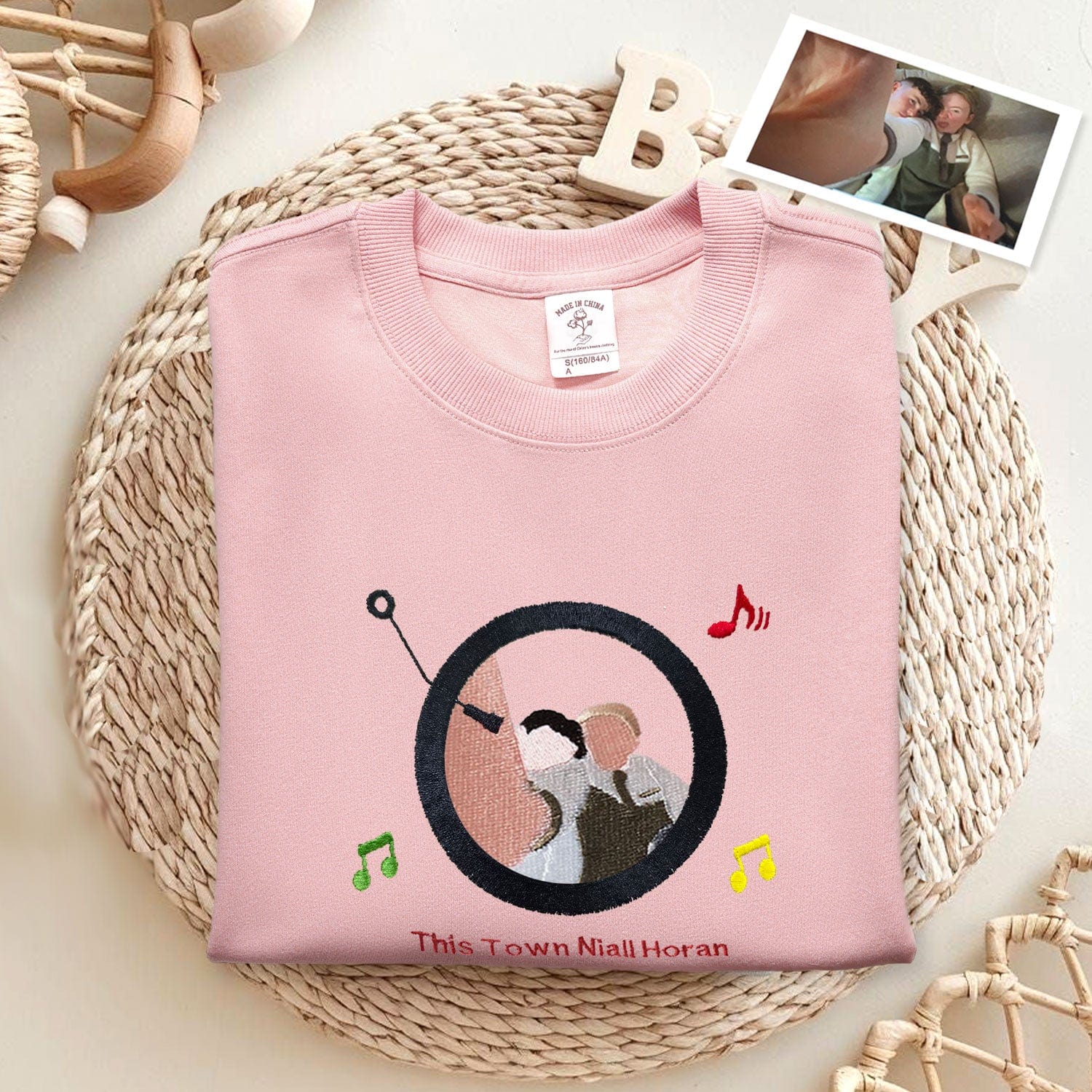 Custom embroidered couple portrait sweatshirt with music player design as a romantic gift