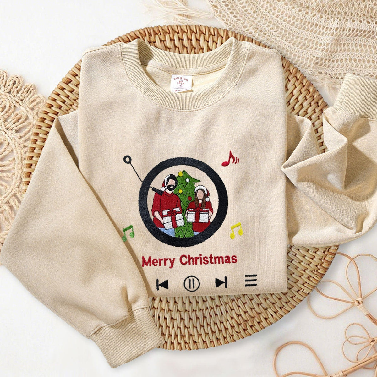 Embroidered music player design with personalized portrait on custom sweatshirt
